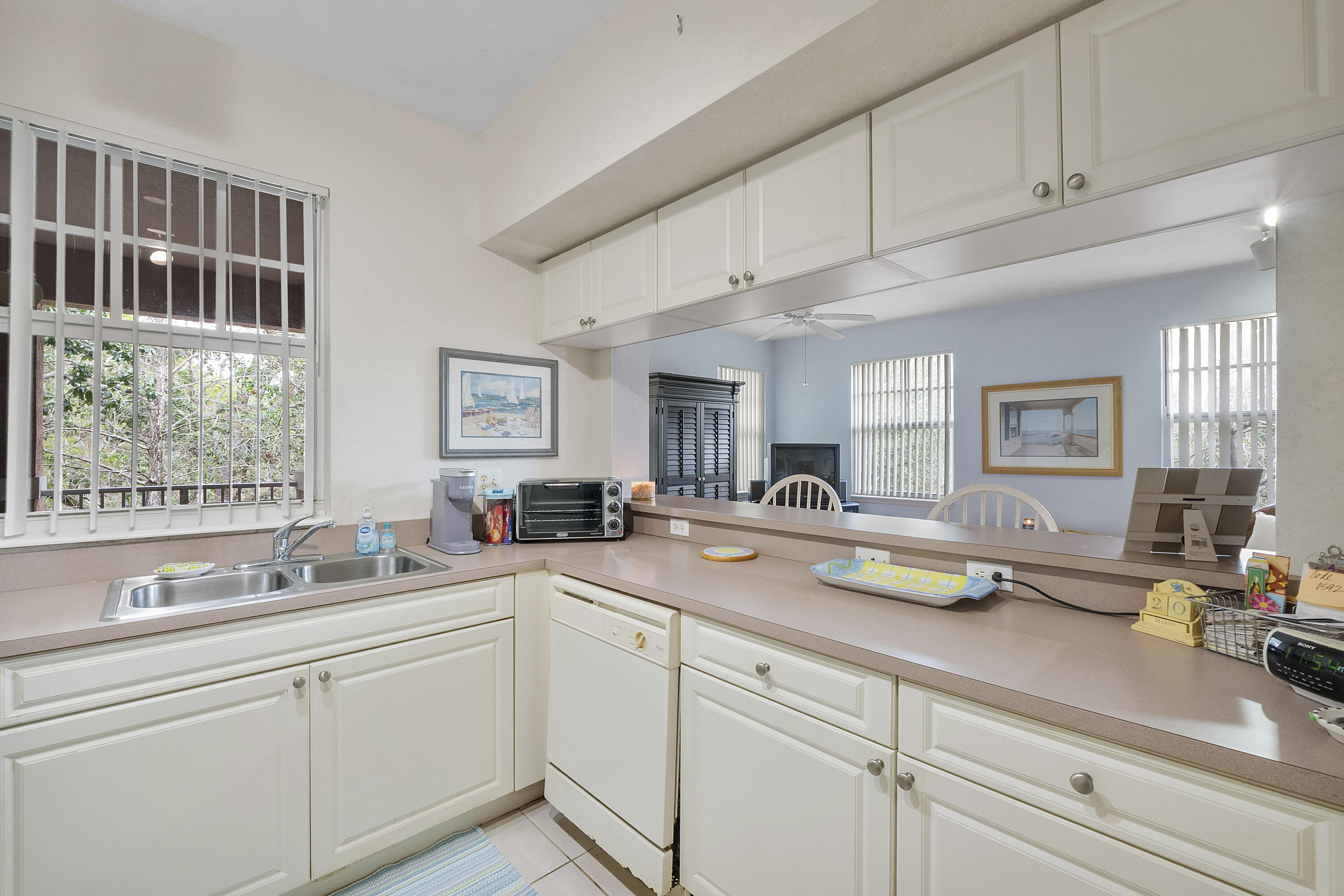 6592 West Sample Road, Unit 6592 Coral Springs, FL 33067 - Photo 14 of 42 a kitchen with sink and window