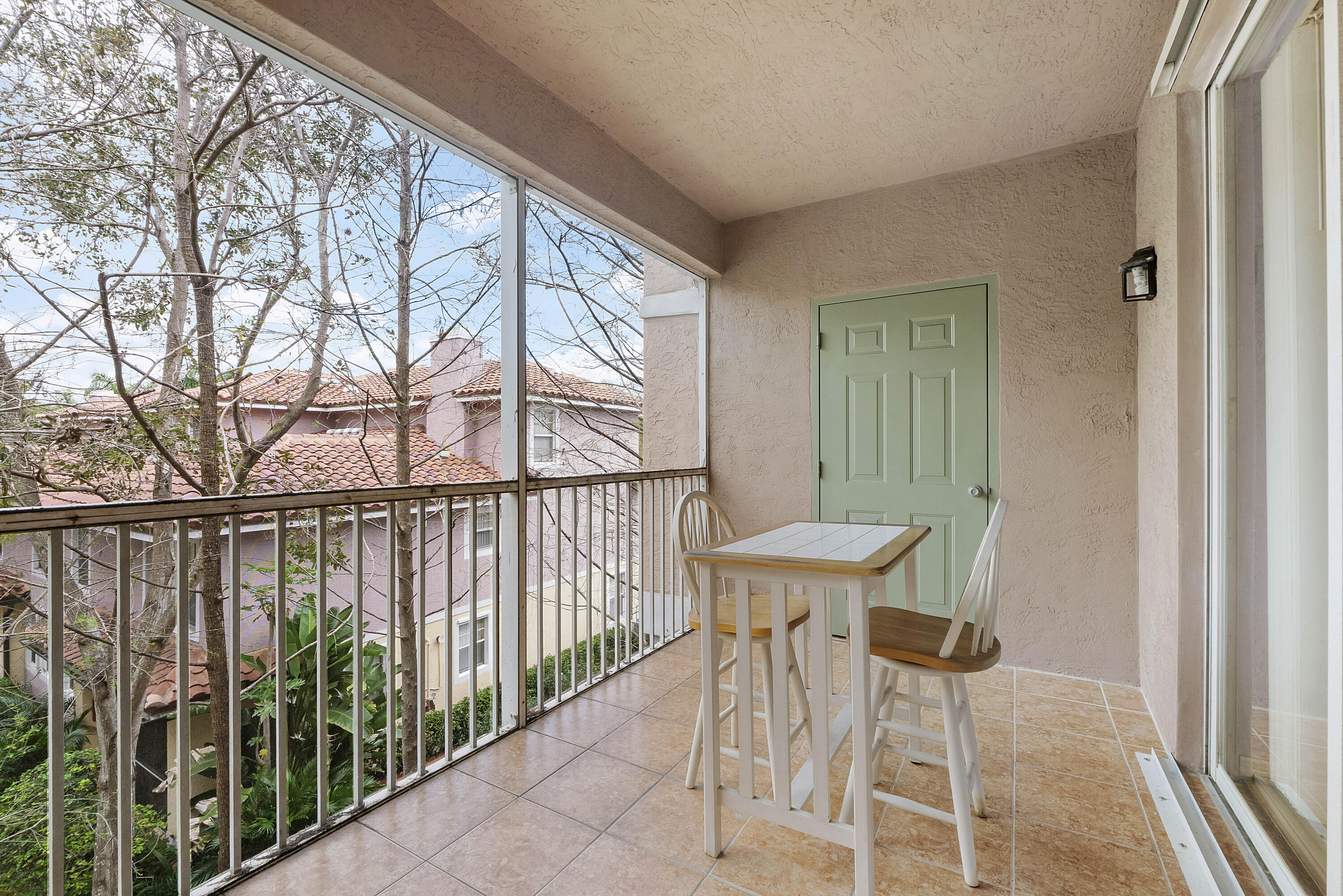6592 West Sample Road, Unit 6592 Coral Springs, FL 33067 - Photo 15 of 42 a view of a balcony with furniture