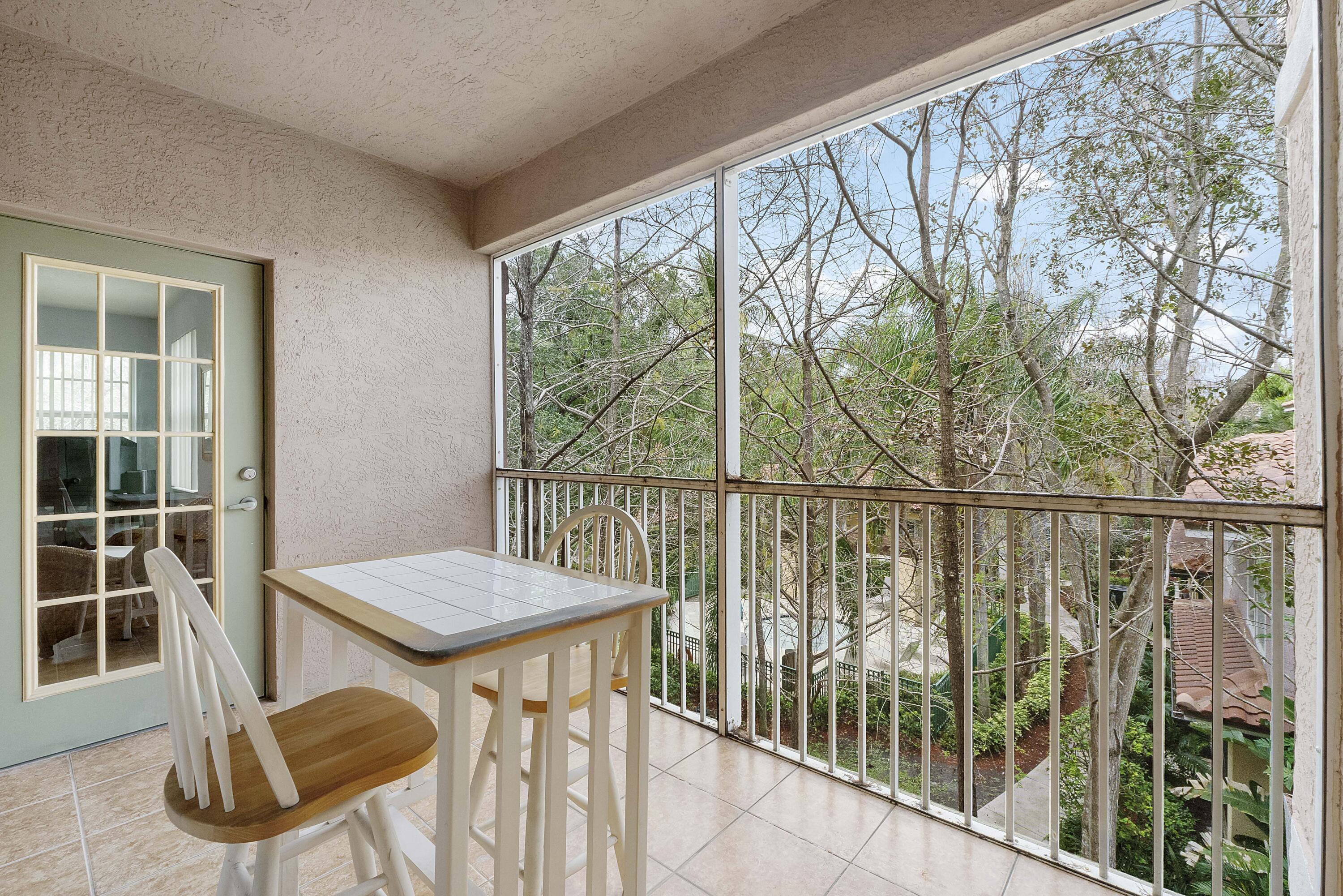 6592 West Sample Road, Unit 6592 Coral Springs, FL 33067 - Photo 16 of 42 a view of a balcony with chairs