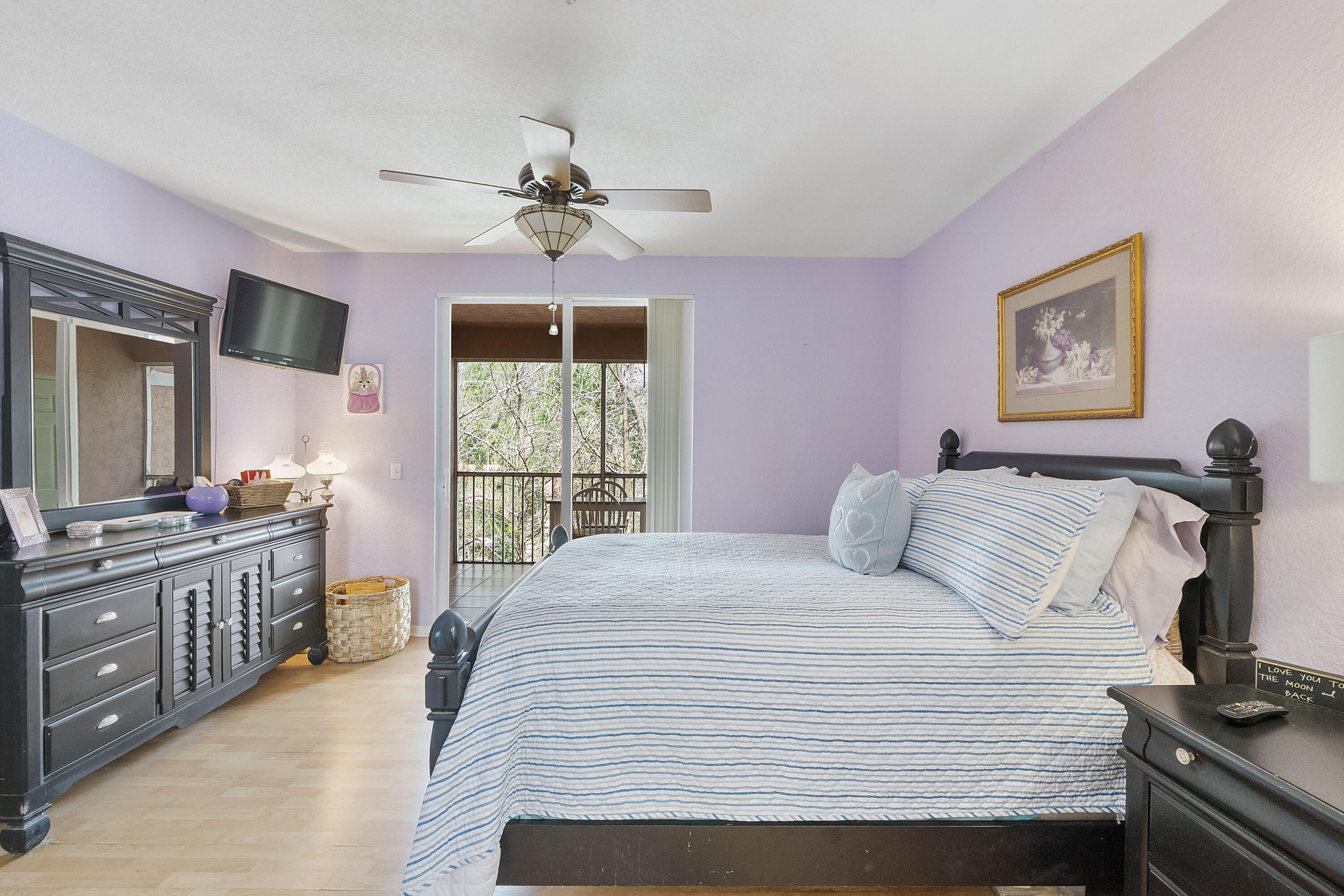 6592 West Sample Road, Unit 6592 Coral Springs, FL 33067 - Photo 20 of 42 a bedroom with a large bed and a window