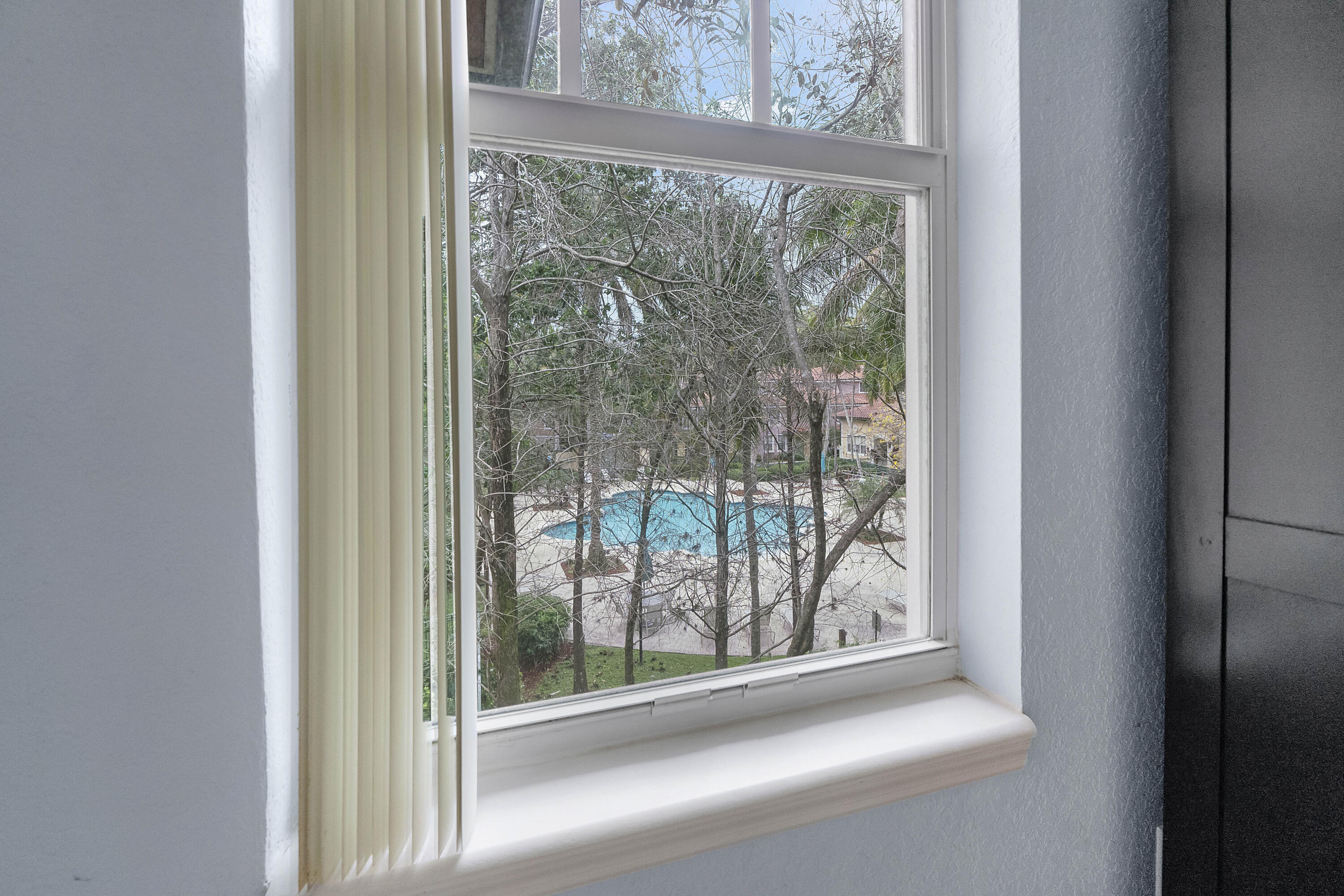 6592 West Sample Road, Unit 6592 Coral Springs, FL 33067 - Photo 26 of 42 a view of a glass door and a window