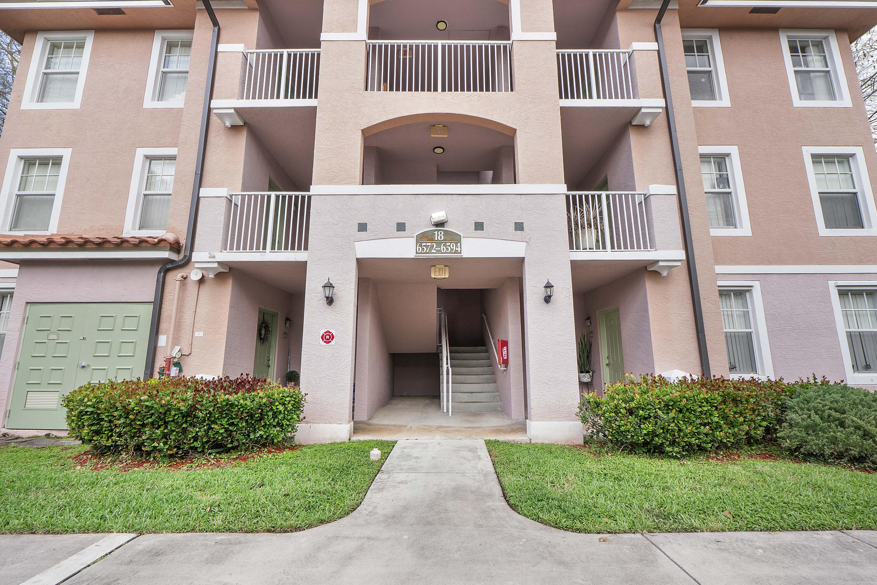 6592 West Sample Road, Unit 6592 Coral Springs, FL 33067 - Photo 29 of 42 front view of a building
