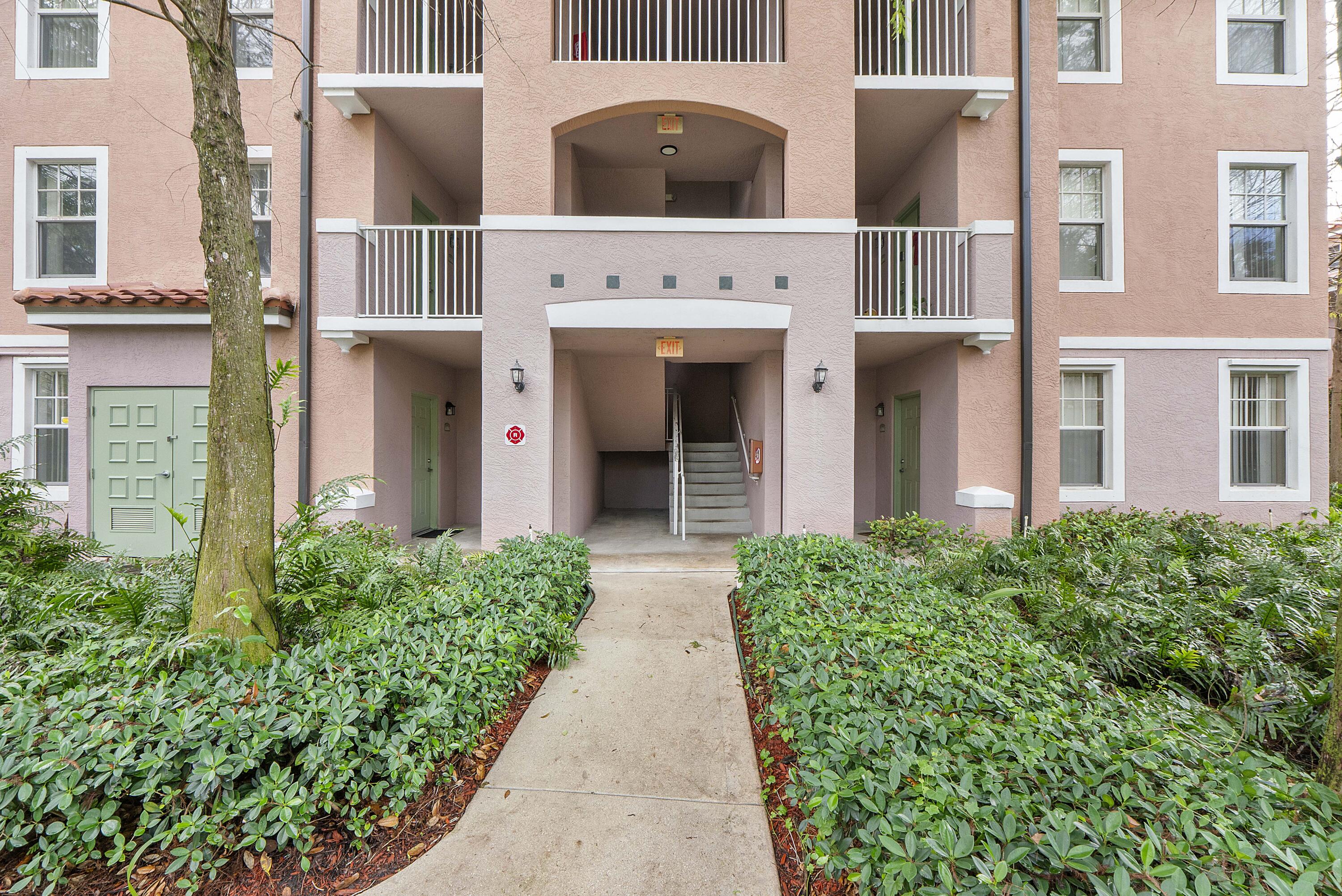 6592 West Sample Road, Unit 6592 Coral Springs, FL 33067 - Photo 30 of 42 front view of building with a entrance
