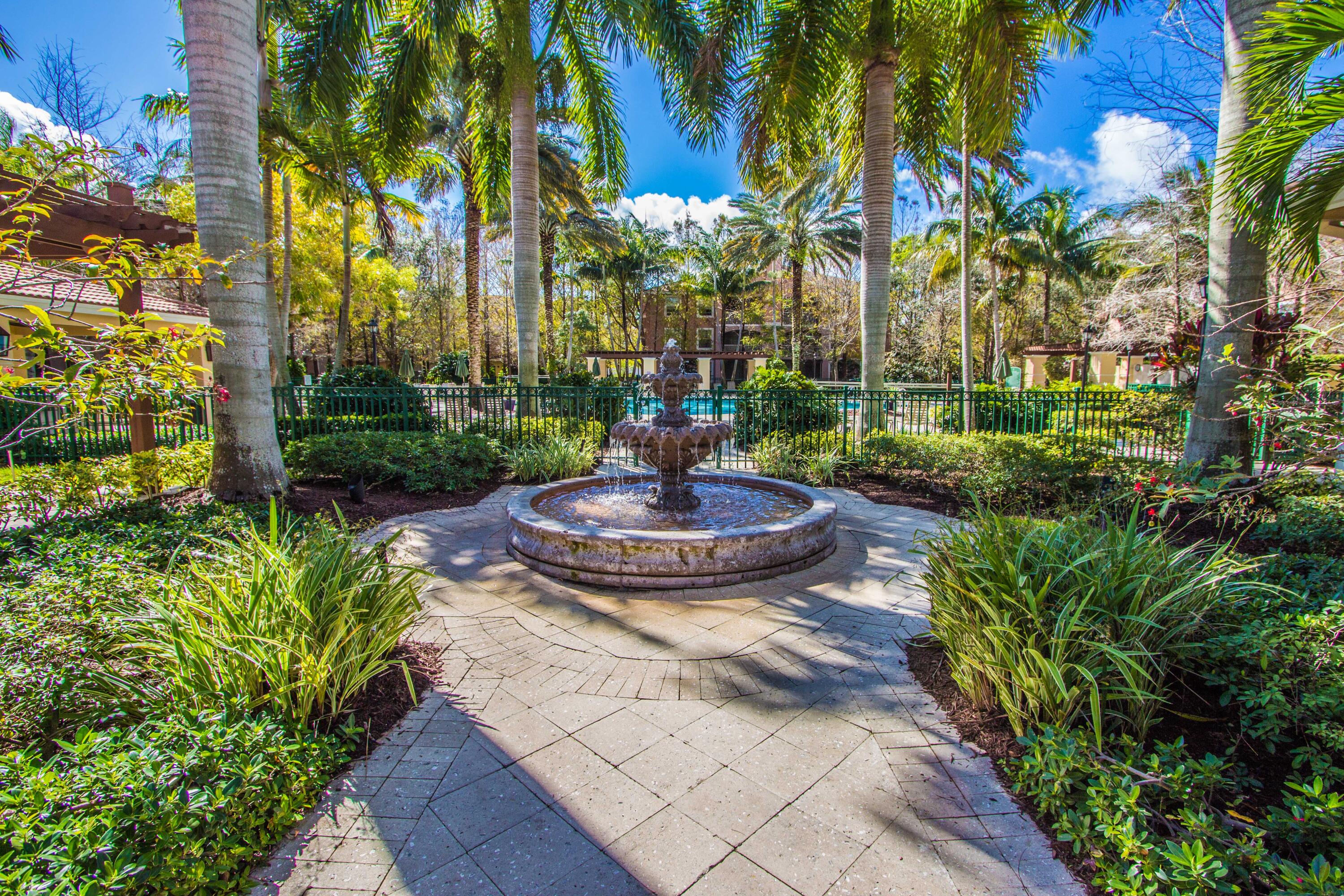 6592 West Sample Road, Unit 6592 Coral Springs, FL 33067 - Photo 39 of 42 a view of a fountain in the garden of a building