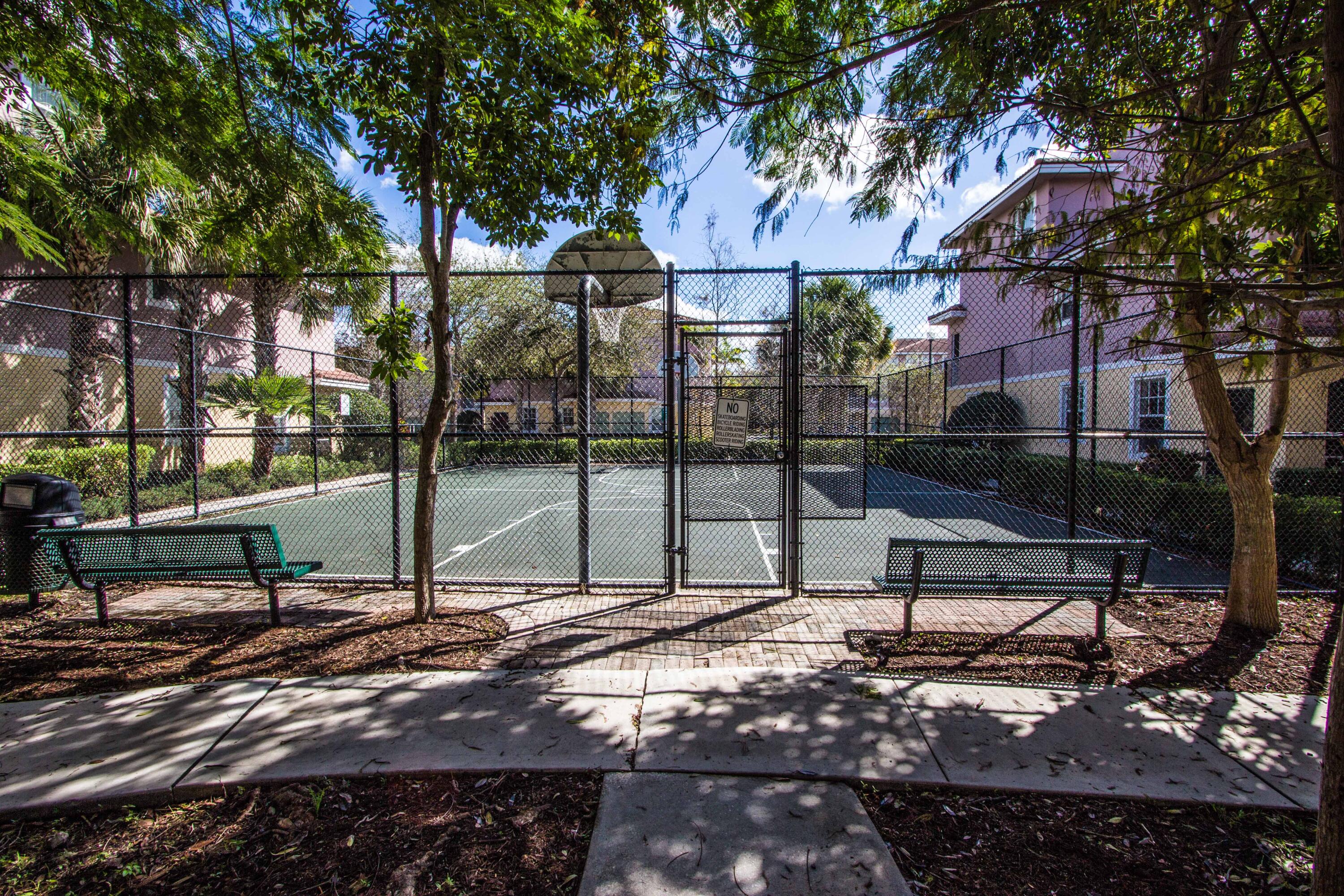 6592 West Sample Road, Unit 6592 Coral Springs, FL 33067 - Photo 41 of 42 a view of a bench in a backyard