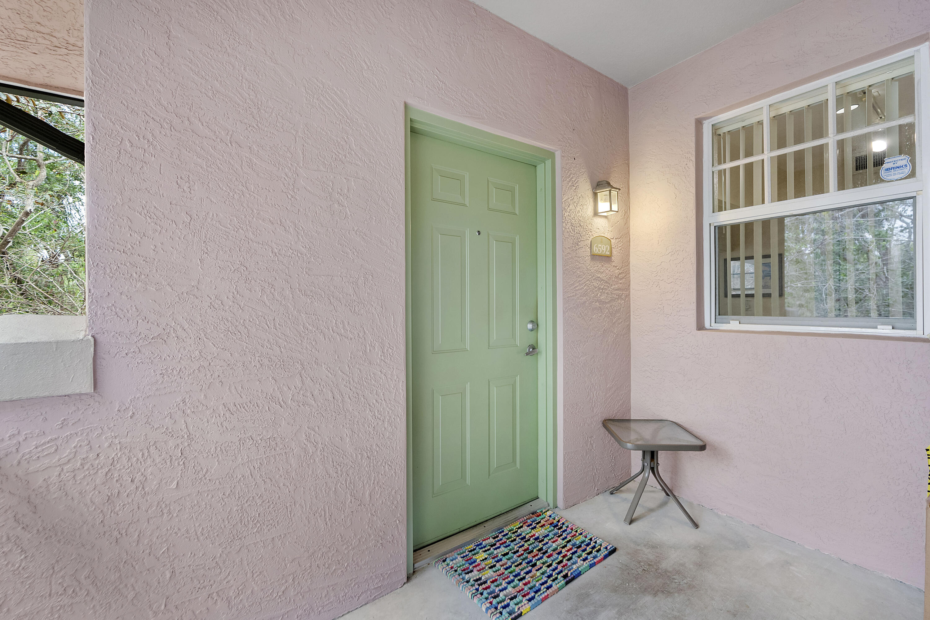 6592 West Sample Road, Unit 6592 Coral Springs, FL 33067 - Photo 8 of 42 a view of a room that has a bench and a window