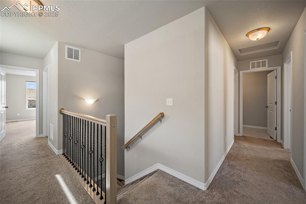 7768 Bone Crk Road Colorado Springs, CO 80924 - Photo 11 of 25 a view of a hallway with closet area