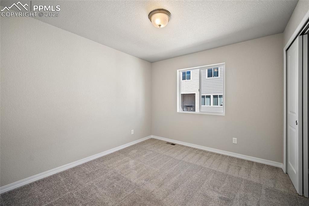 7768 Bone Crk Road Colorado Springs, CO 80924 - Photo 14 of 25 an empty room with windows