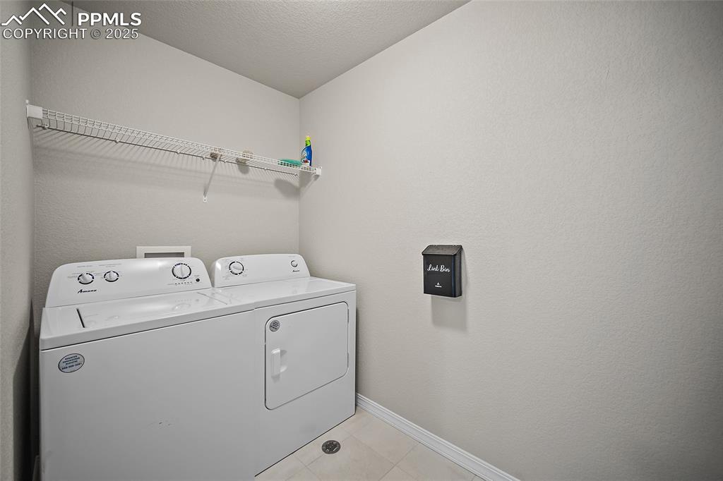 7768 Bone Crk Road Colorado Springs, CO 80924 - Photo 15 of 25 a utility room with dryer and washer