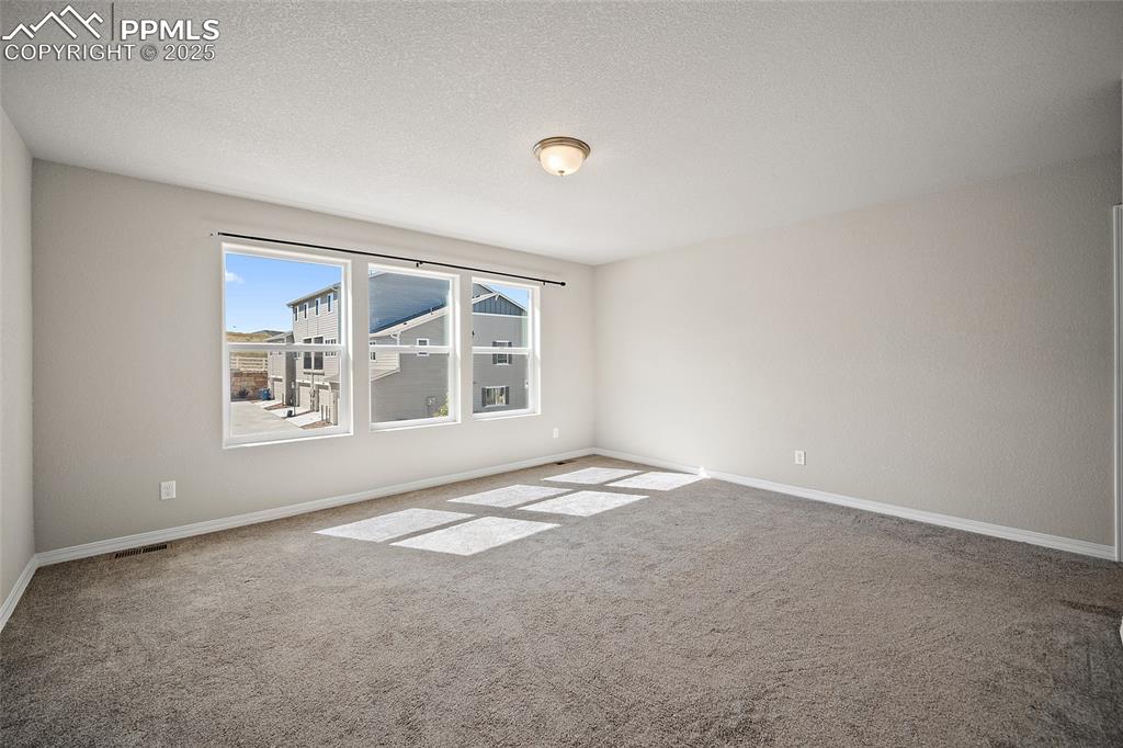 7768 Bone Crk Road Colorado Springs, CO 80924 - Photo 17 of 25 a view of an empty room with a window
