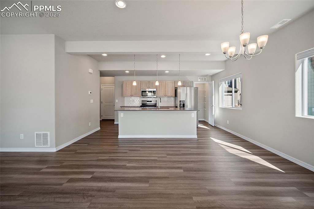 7768 Bone Crk Road Colorado Springs, CO 80924 - Photo 7 of 25 a view of a kitchen and chandelier