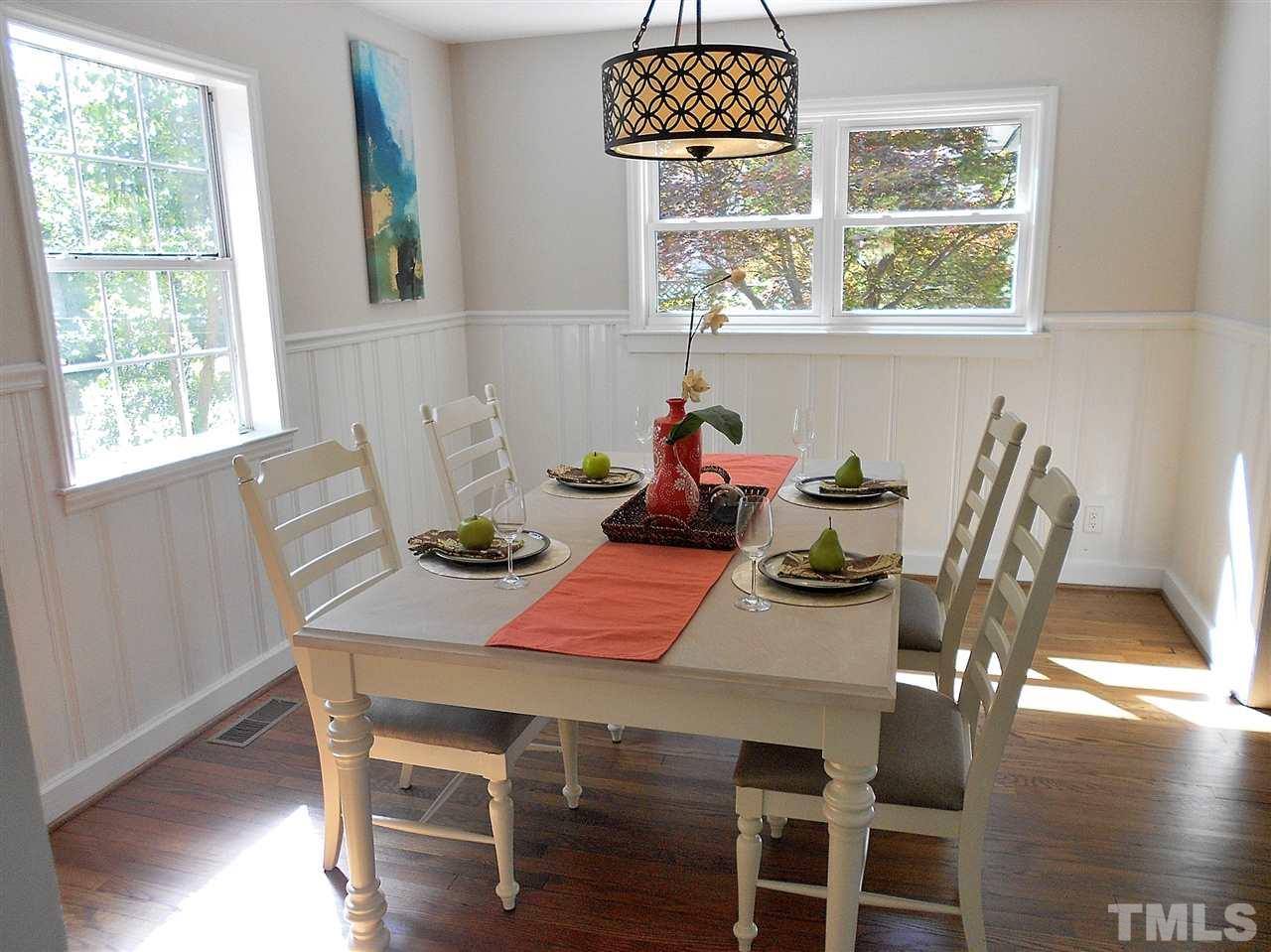 3307 Hall Place Raleigh, NC 27607 - Photo 3 of 24 a view of a dining room with furniture window and wooden floor