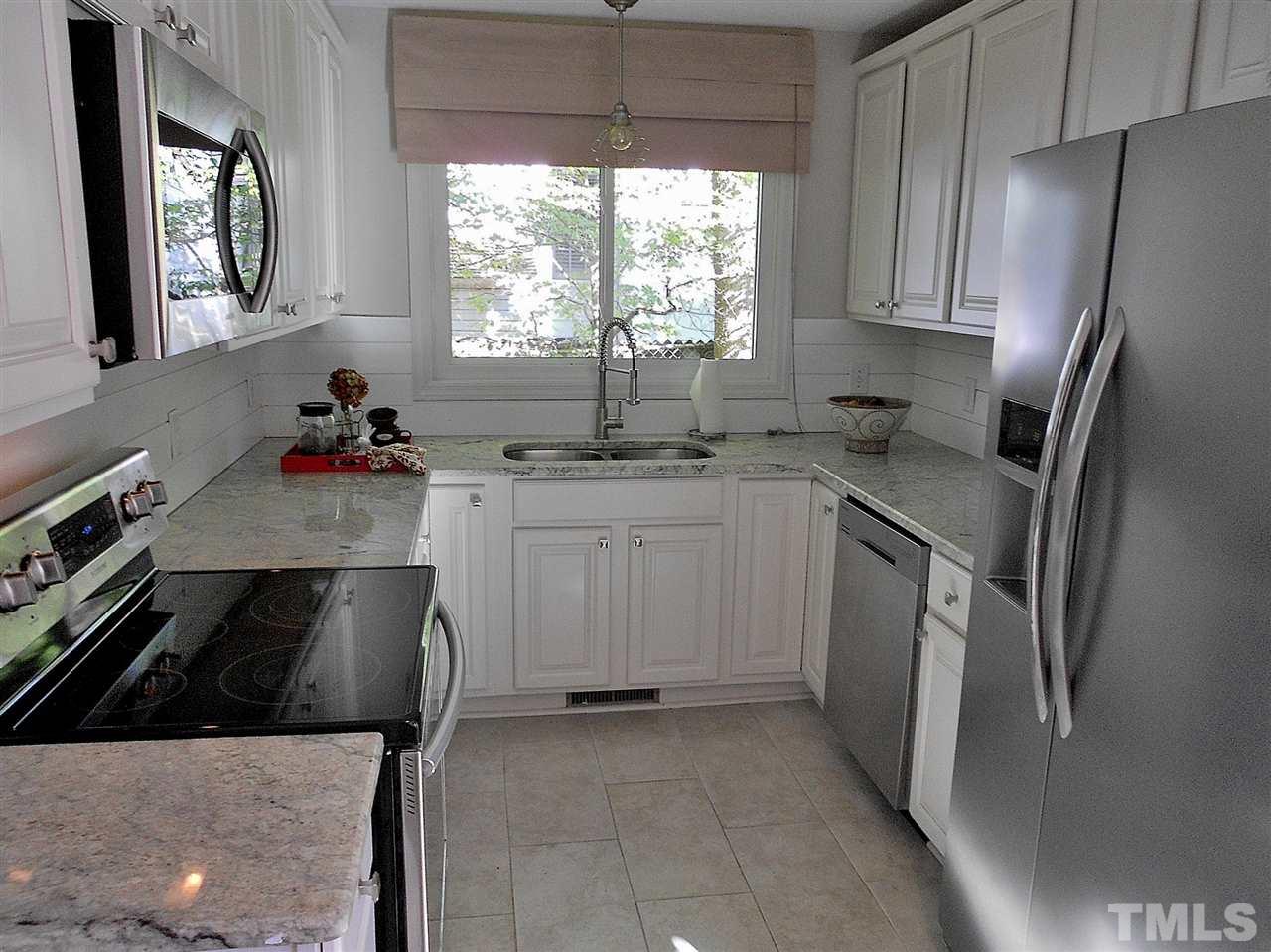 3307 Hall Place Raleigh, NC 27607 - Photo 5 of 24 a kitchen with a stove sink and refrigerator