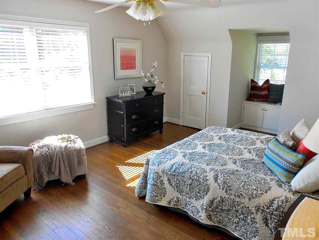 3307 Hall Place Raleigh, NC 27607 - Photo 9 of 24 a bedroom with a bed and a dresser