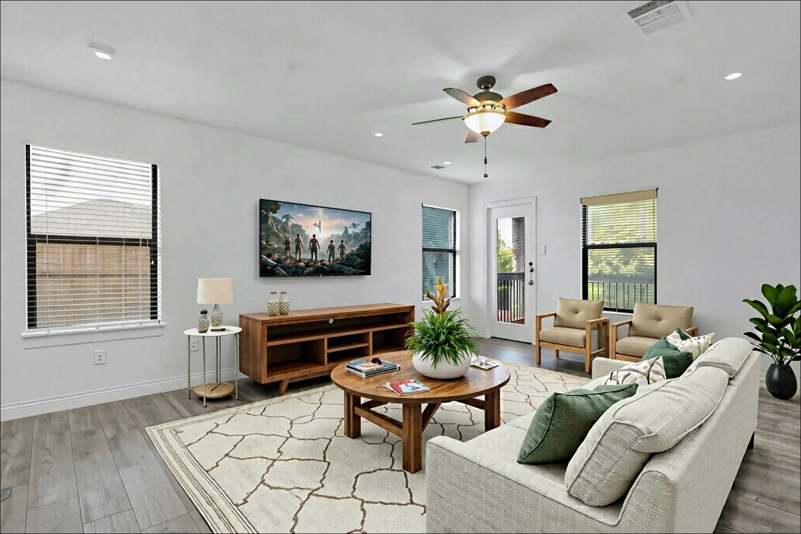 10217 English Oak Drive Austin, TX 78748 - Photo 17 of 31 a living room with furniture a wooden floor and a window