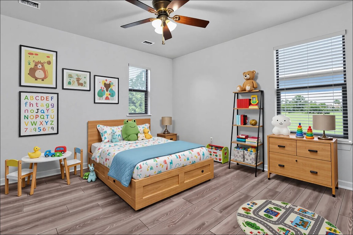 10217 English Oak Drive Austin, TX 78748 - Photo 26 of 31 a bedroom with a bed and a bookshelf