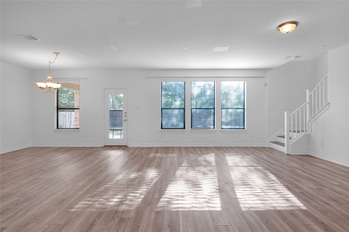 10217 English Oak Drive Austin, TX 78748 - Photo 9 of 31 wooden floor in an empty room with a window