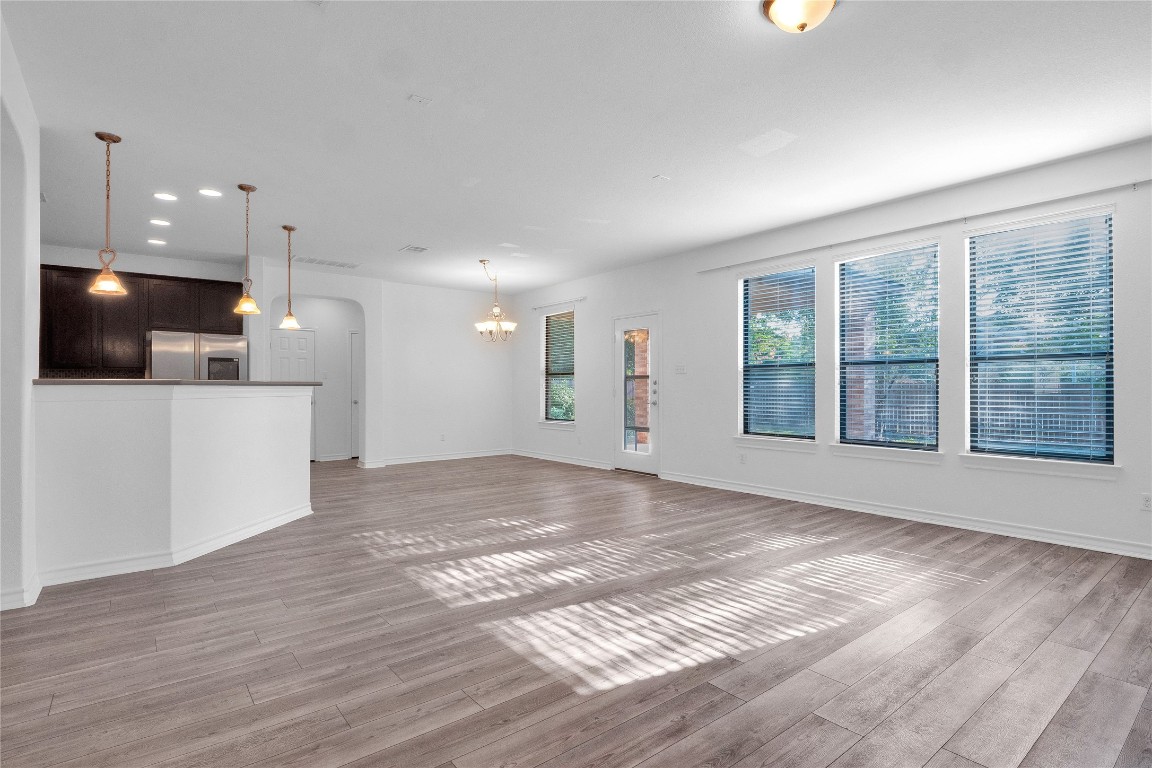 10217 English Oak Drive Austin, TX 78748 - Photo 10 of 31 a view of an empty room with kitchen and a window