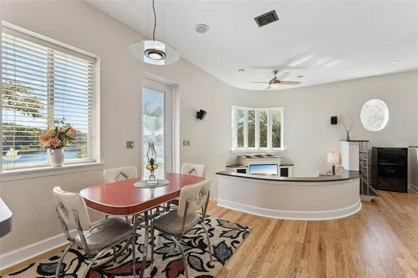 a kitchen with a sink stove top oven and cabinets