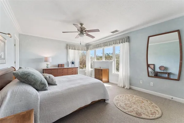 a bedroom with a bed and a cabinets