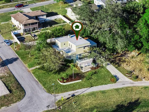 an aerial view of residential houses with outdoor space