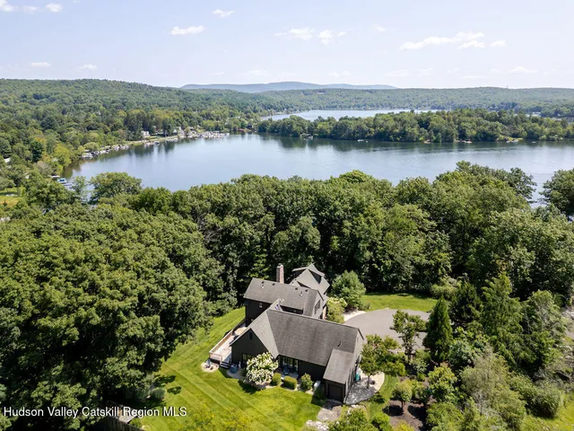 a view of a lake with a house in the background