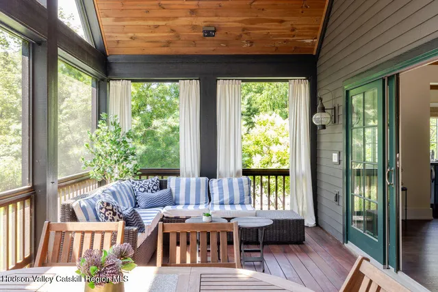 a kitchen with stainless steel appliances granite countertop table chairs and wooden cabinets
