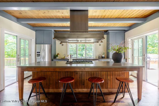 a kitchen with stainless steel appliances granite countertop a stove and a sink