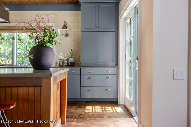 a spacious bathroom with a bathtub sink and mirror