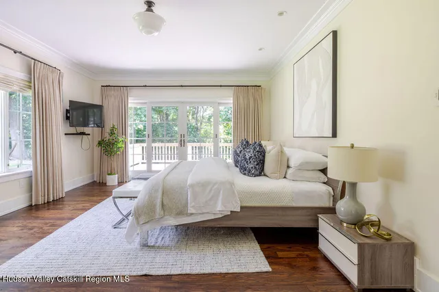 a en suite bathroom with a granite countertop sink and a mirror