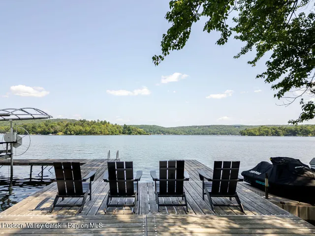 a view of a lake with houses in the back