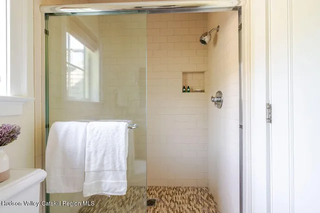 a en suite bathroom with a sink and mirror