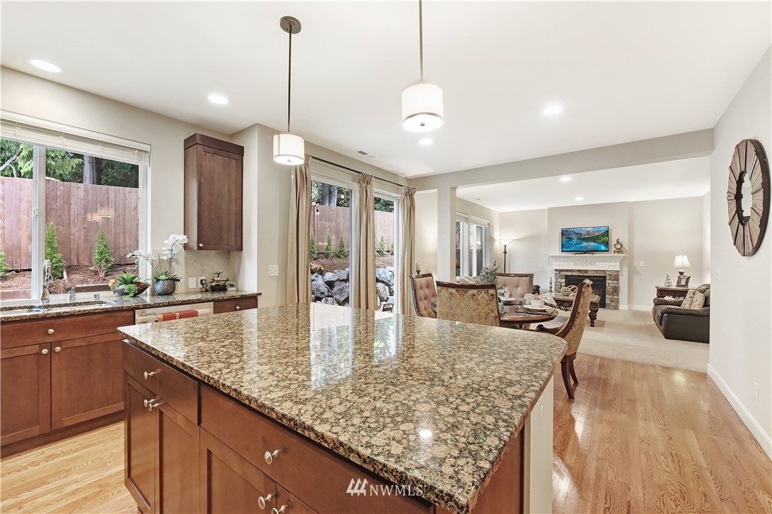 4321 229th Place Southeast Bothell, WA 98021 - Photo 13 of 31 a kitchen with sink refrigerator and large window
