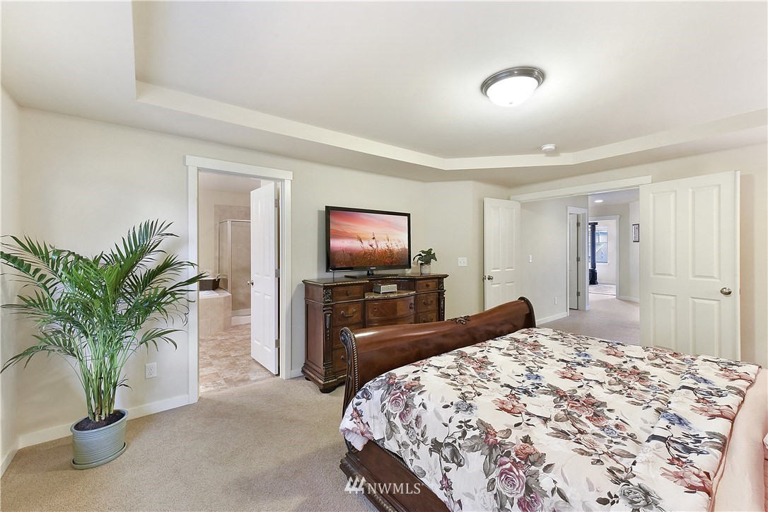 4321 229th Place Southeast Bothell, WA 98021 - Photo 15 of 31 a bedroom with a bed and a television