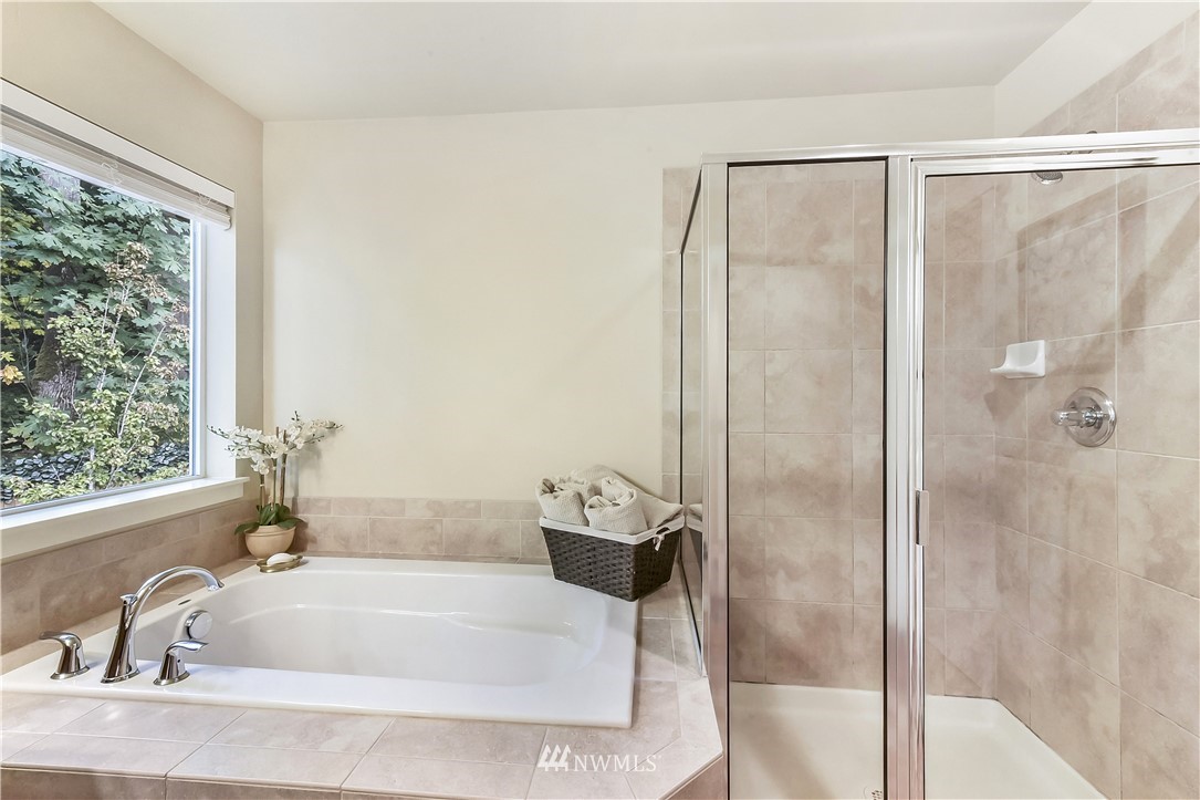 4321 229th Place Southeast Bothell, WA 98021 - Photo 17 of 31 a bathroom with a tub and shower