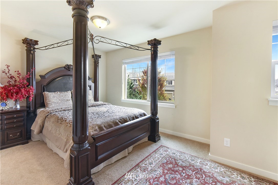 4321 229th Place Southeast Bothell, WA 98021 - Photo 19 of 31 a bedroom with a bed and a window