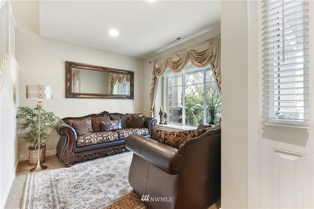 4321 229th Place Southeast Bothell, WA 98021 - Photo 4 of 31 a living room with furniture and a large window