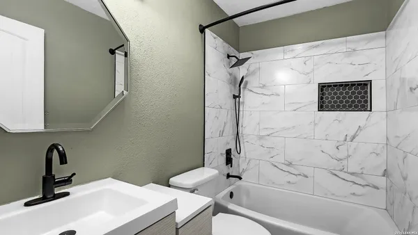 a bathroom with a sink and a bathtub