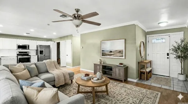 a living room with furniture and a view of living room