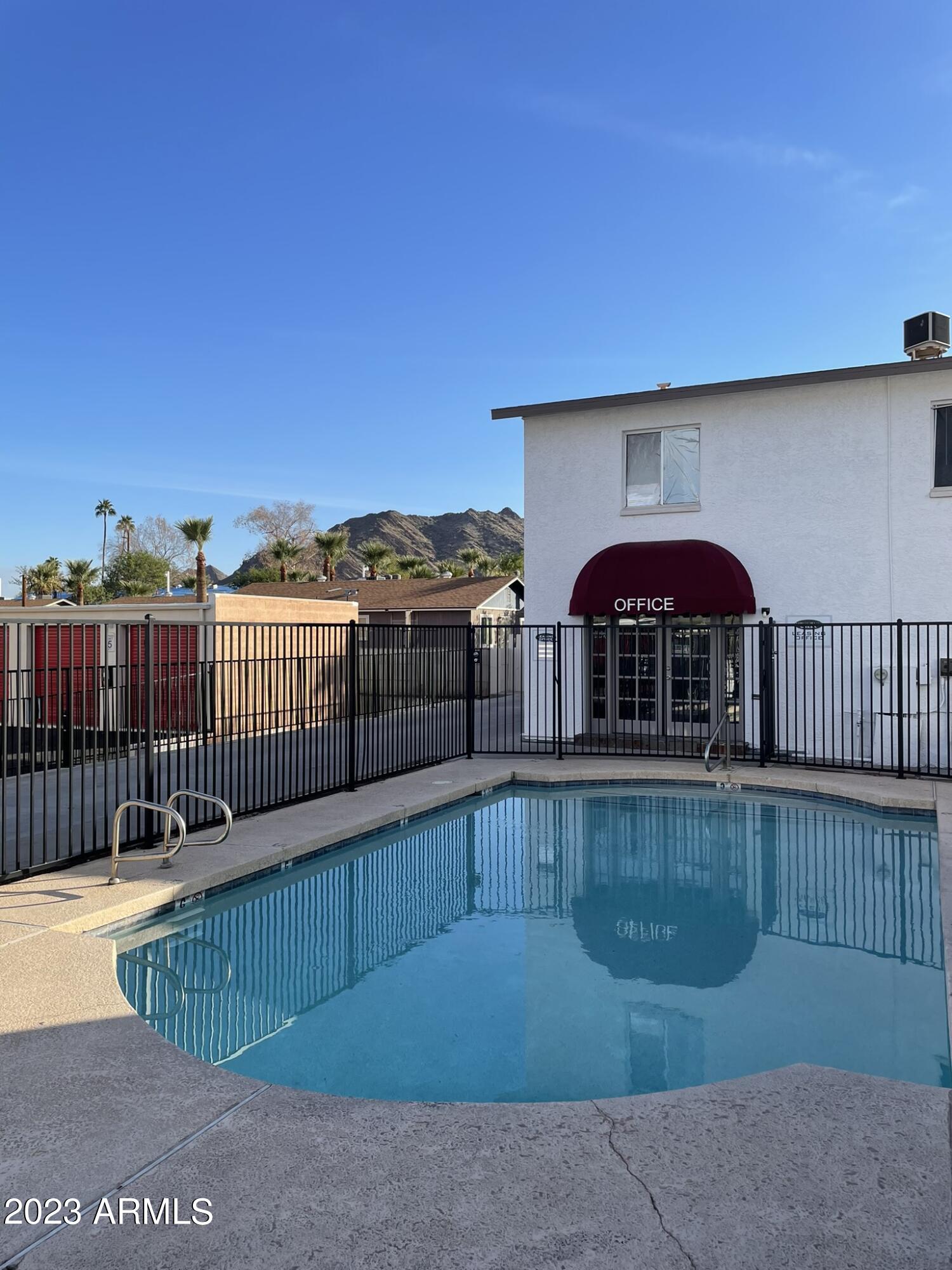 1222 East Mountain View Road, Unit 112 114 Phoenix, AZ 85020 - Photo 16 of 21 a view of a chairs with wooden fence
