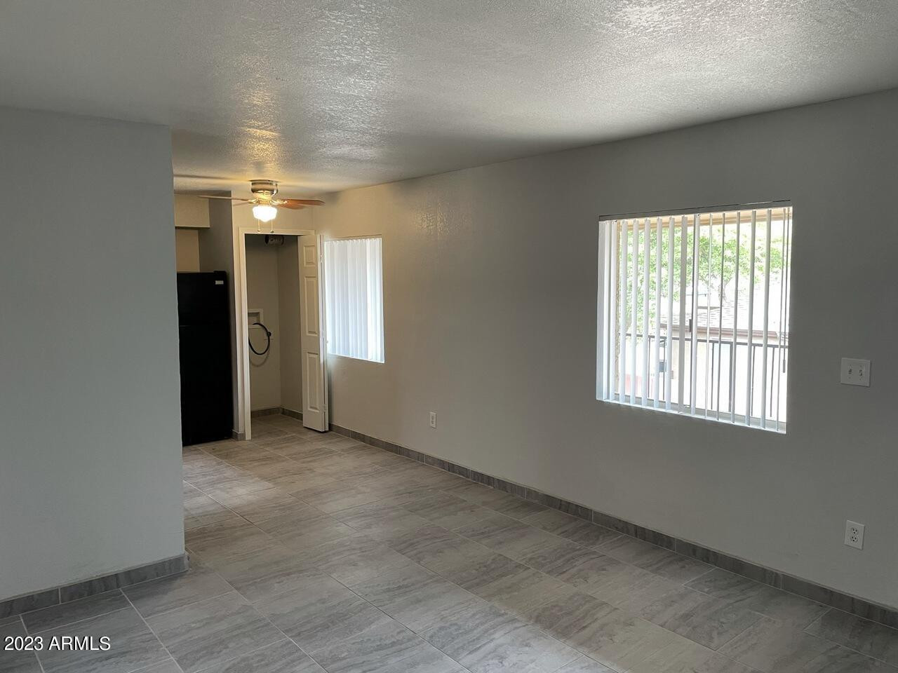 1222 East Mountain View Road, Unit 114 208 214 Phoenix, AZ 85020 - Photo 4 of 21 an empty room with windows and closet