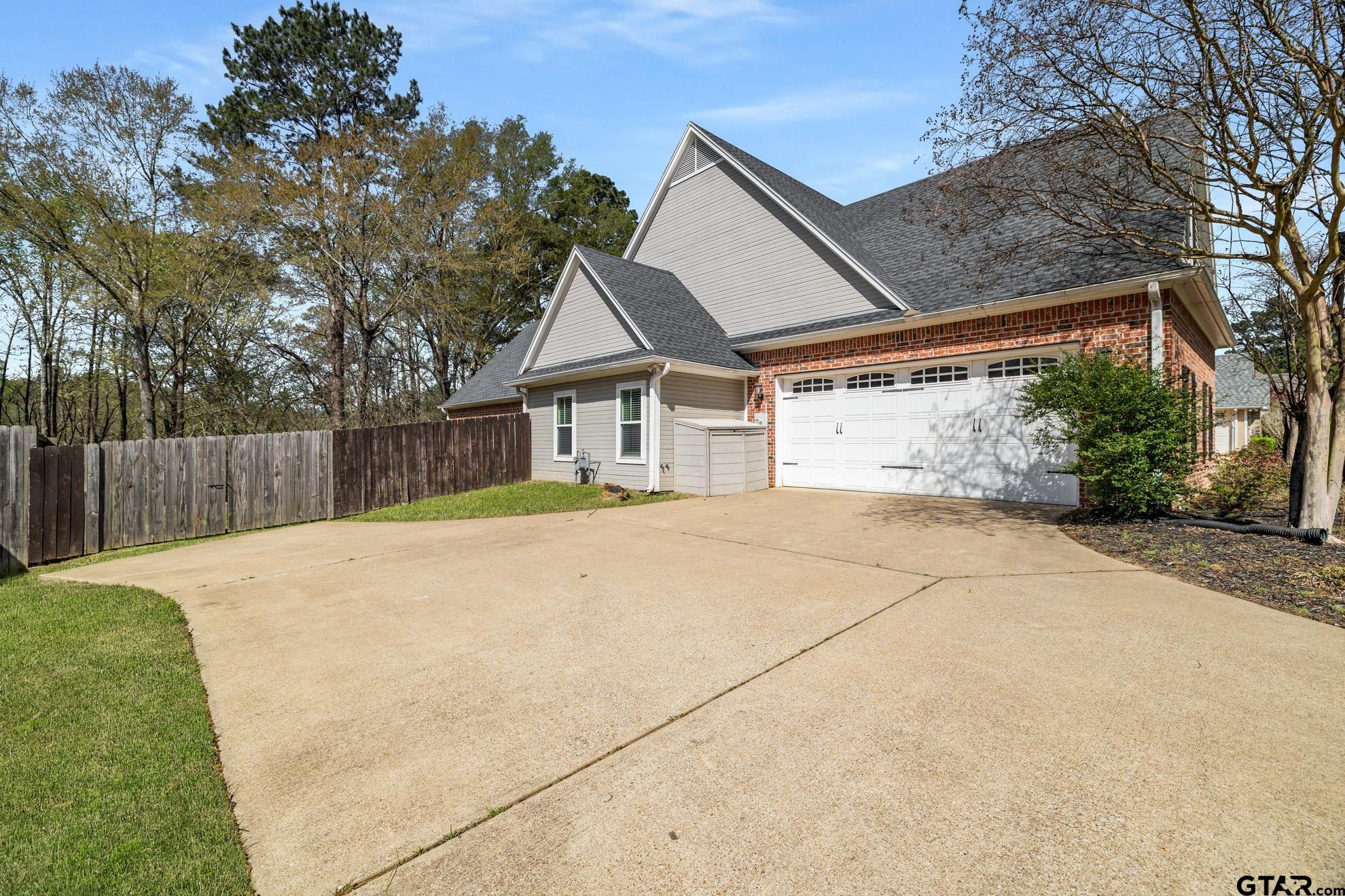 9453 Cherokee Trail Tyler, TX 75703 - Photo 38 of 40 a house with trees in front of it