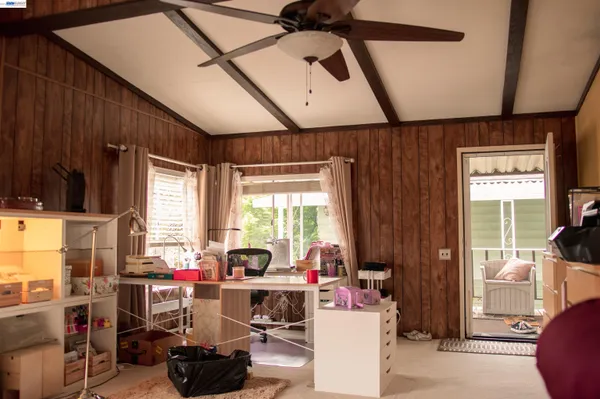 a work room with furniture and a window