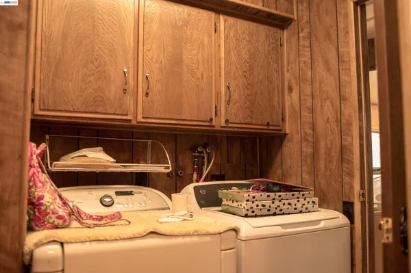 a vase of flowers sitting on a floor