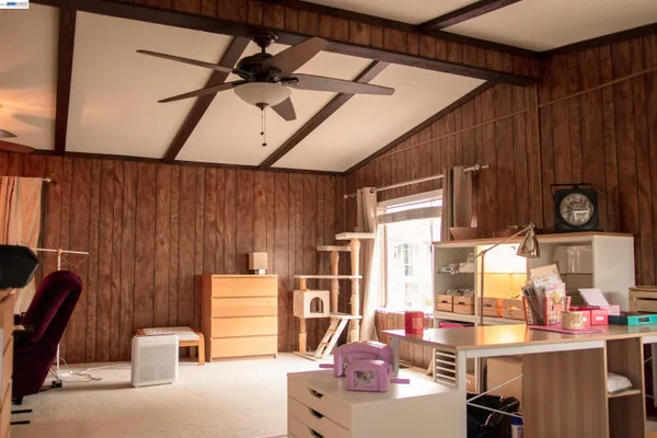 a room with furniture and musical instruments