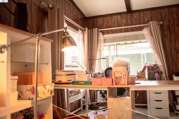 a kitchen with stainless steel appliances a sink and a large window