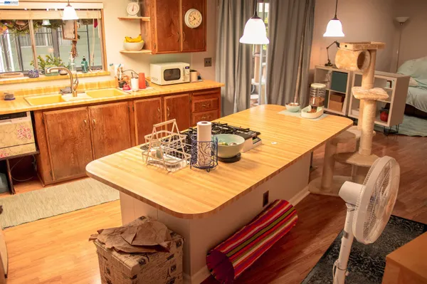 a kitchen with a sink and a window