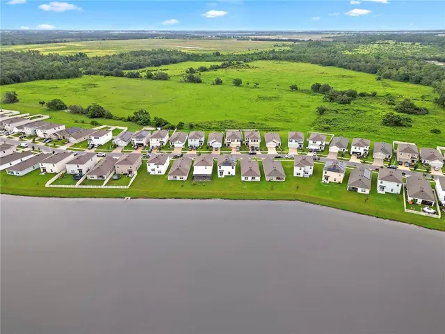 a view of a field with an ocean view