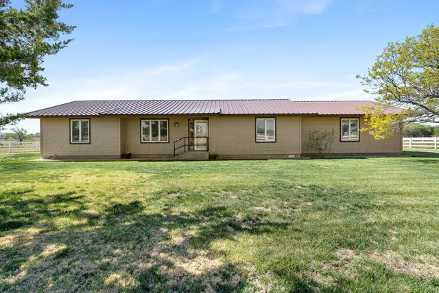 a front view of building with yard