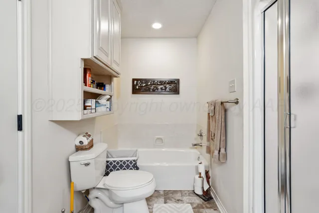a bathroom with a toilet a sink and a bathtub